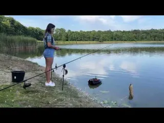 Girl Solo Сamping Rest Fishing on the shore of a