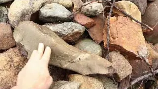 Moving large boulders on the hillside in a race with the