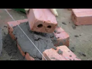 Using bricks and cement to build new pigsty that fits with