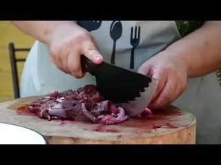 Grandma Butchering Young Lamb in the Village and Prepares