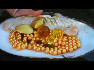 Watch this girl find glowing pearls hidden inside giant