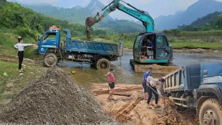 Excavators and trucks transport sand and gravel from the