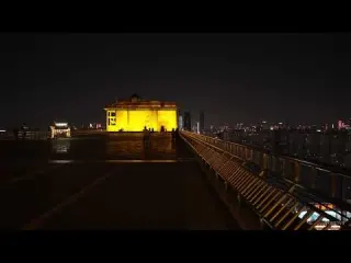 Exploring a Golden Rooftop Above the City at Night 4K