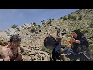 Iran nomadic life Starting a traditional bath with stones