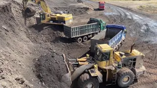 Loader Loading Coal On Trucks