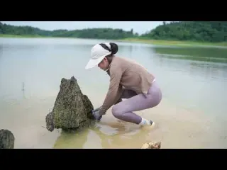 Young Girl Cuts Into a Giant Driftwood Root Then Turns It