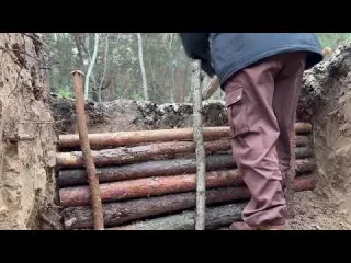 Surviving the Night Snow Wind and a Wolf Bushcraft Dugout