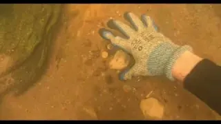 Treasure hunters dive beneath the bridge of wishes