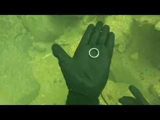 Diving into a waterfall in search of valuable objects