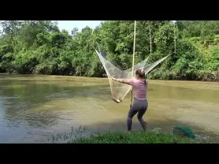 Girl Fishing Traditional Fishing using Bamboo and Fishing