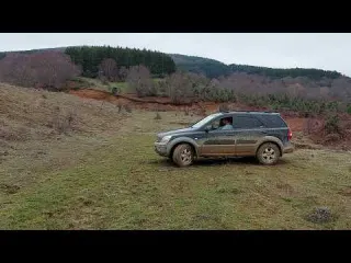 Kia Sorento off road Toyota Land Cruiser mud uphill