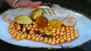 Watch this girl find glowing pearls hidden inside giant