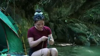Solo girl Camping Fishing by a Wild Forest Stream