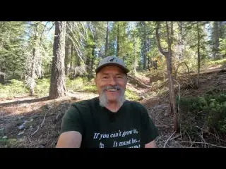 Detecting for gold while exploring a hydro pit in the high