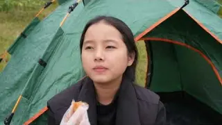 Solo camping in the meadow and enjoying the fresh air