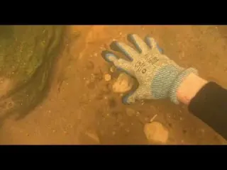 Treasure hunters dive beneath the bridge of wishes