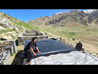 How do nomads build a rainproof roof with wood and plastic
