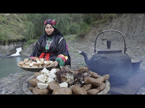 DAGESTAN. Tindi village woman makes traditional food -