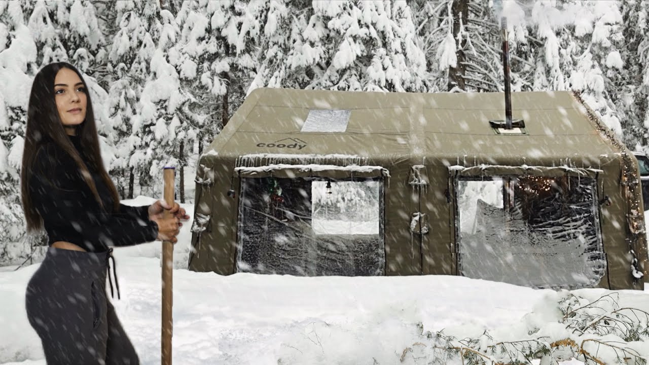 Winter Camp in Heavy Snowfall with air Hot tent in the