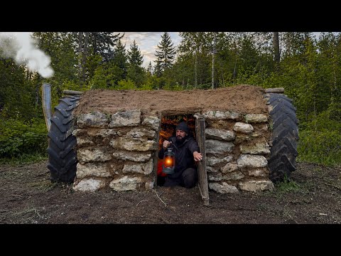 Building a bushcraft shelter from tractor wheels and stone