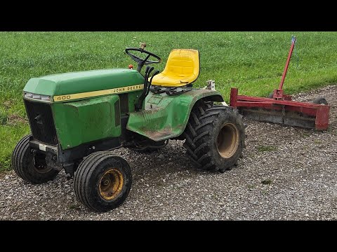 Grading / fixing the driveway with john deere 400 garden