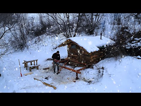 I'm building a simple log cabin, Winter, overnight at the