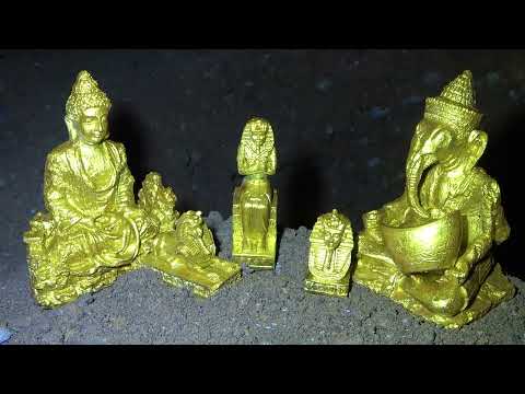 The boy was lucky to find two golden Buddha under the stone