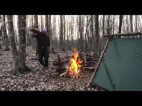 surviving and solo camping in wilderness-cozy shelter: