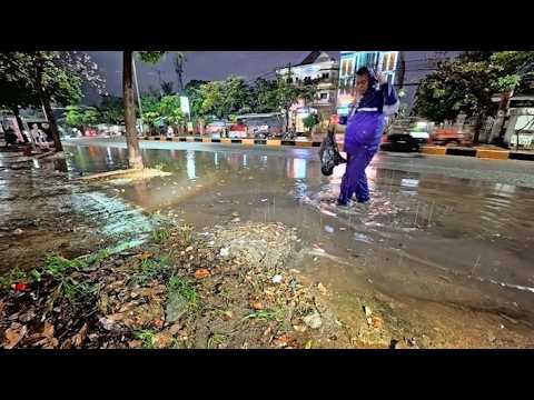 Draining rainwater on the road after heavy rain overnight