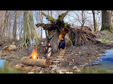 Building a secret shelter inside a fallen tree near a