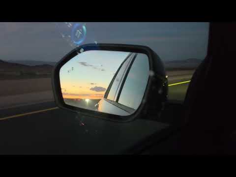 I40 east of Barstow, sun set in the mirror
