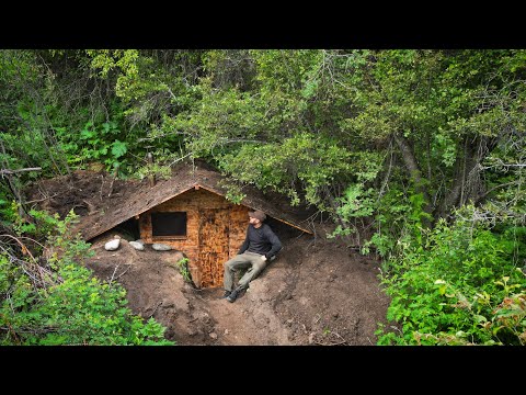 I'm building a shelter in the woods, a cozy survival hut