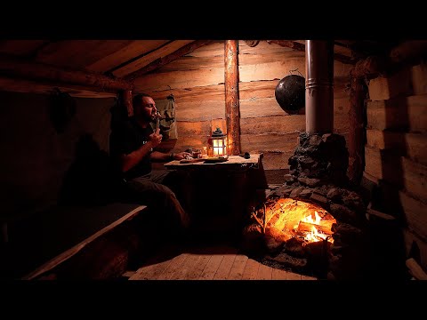 Fireplace in a wooden hut, building a house in nature Solo