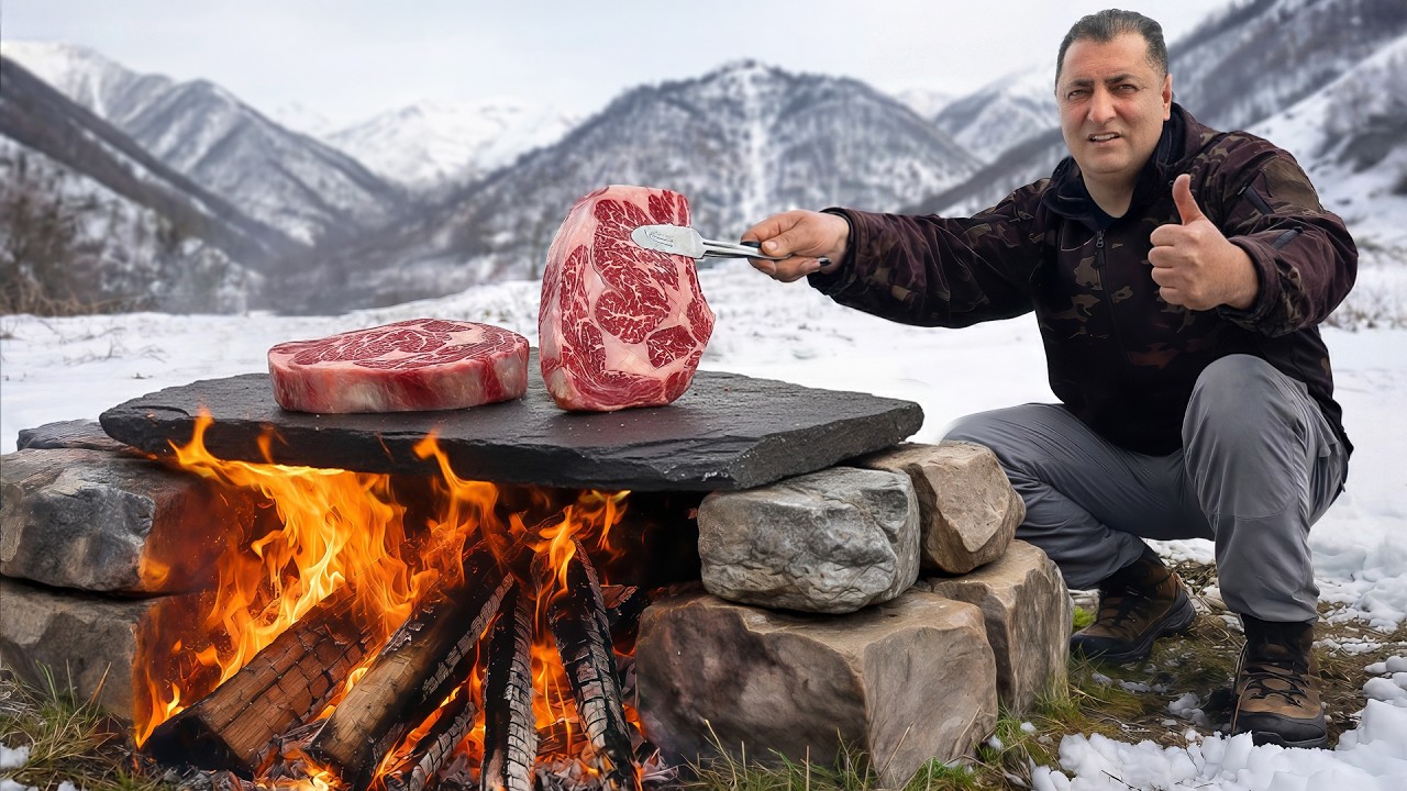 Primal Steaks Cooked on a Hot Stone in the Mountains