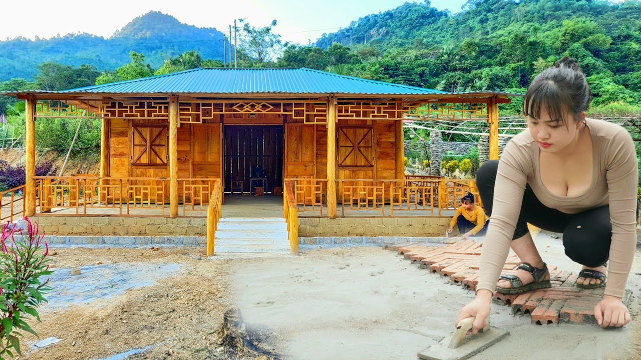 wooden house by herself turns empty land into farm