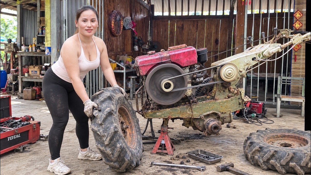 A genius girl repairs an old tractor—changing tires and