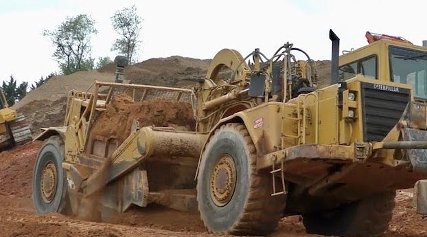 Pushing and Pulling Caterpillar 627 Scrapers