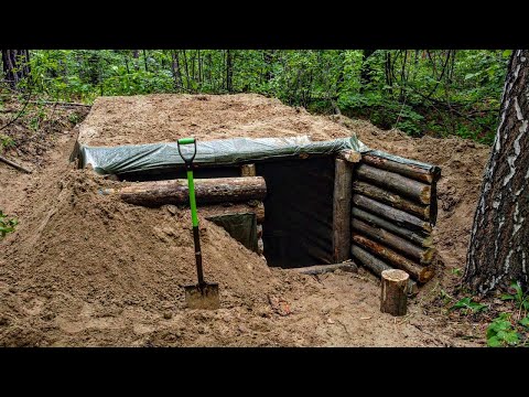 A dugout in a wild forest, building a shelter for life from