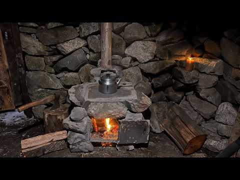 A man restores a stone hut in the mountains Builds a