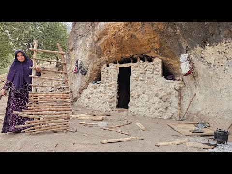 Iranian nomadic woman - building a door for shelter in