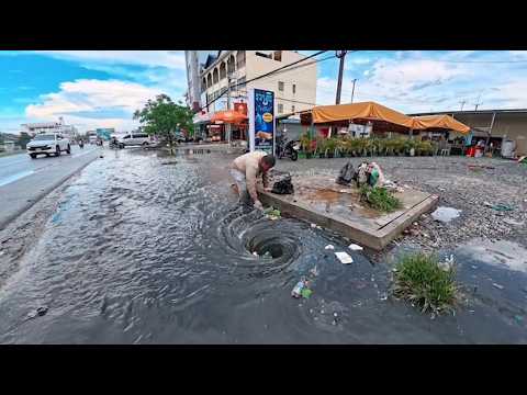 Collect and clear away debris clogging roadside drainage