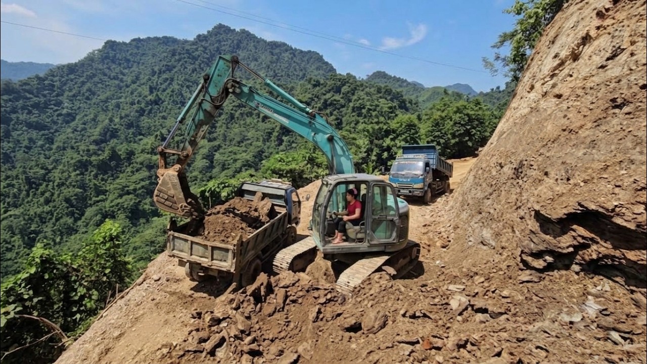 Binh Driving a truck to transport soil and build a road