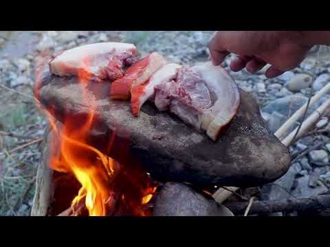survival in the forest by eating pork grilled on stones by