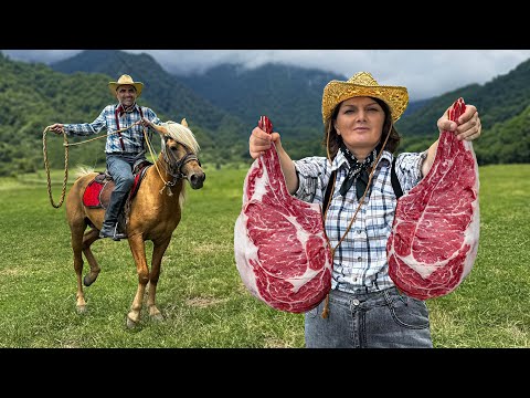 Tomahawk Ribeye Marble Steaks Roasting on Open Fire