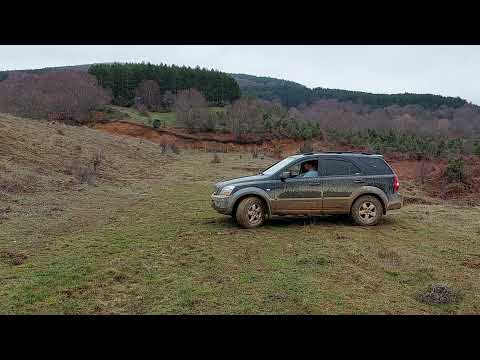 Kia Sorento off road Toyota Land Cruiser mud uphill