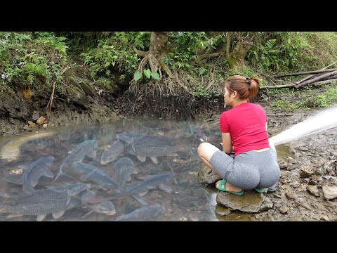 Fishing techniques - Girl uses a motor to release water -
