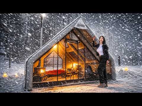 CAMPING IN HEAVY SNOW WITH A TRACTOR IN A NEW INFLATABLE