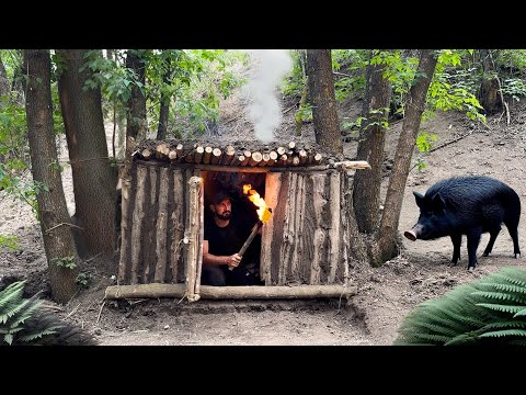 Building a primitive survival shelter escaping from a wild