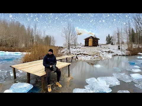 Building of a pier near a fishing hut made from sleepers