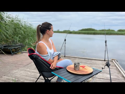 Girl Fishing Alone in a house on the lake Relaxing